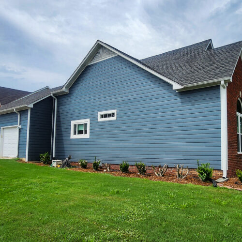 Alside Ascend Siding in Midnight Blue with white trim and corners - Alabama Decks & Exteriors in Birmingham
