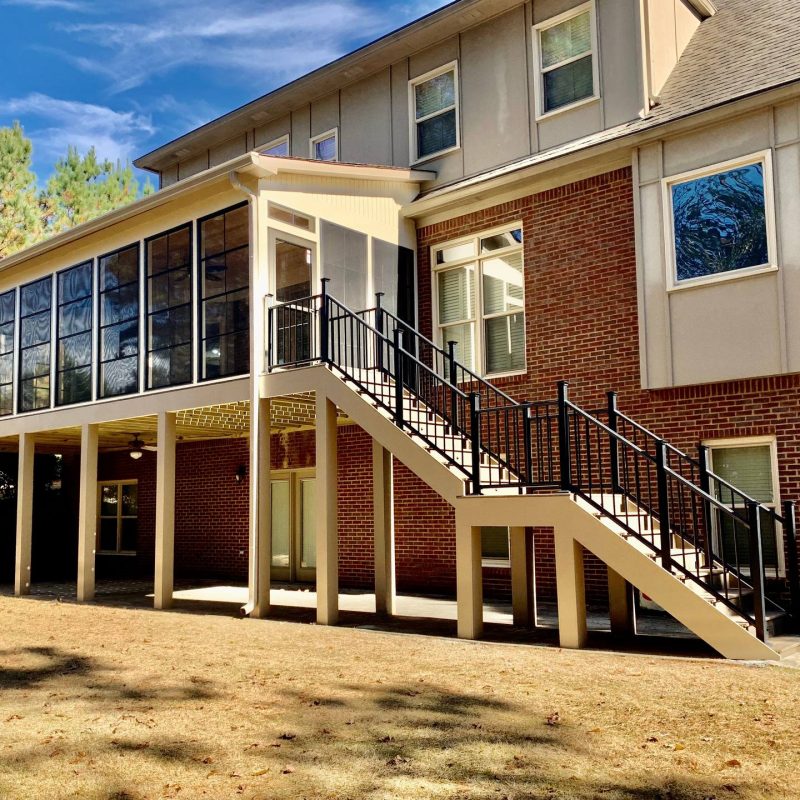 Trex Coastal Bluff and Toasted Sand Eze-Breeze Windows MiraTEC trim and a knotty pine tongue and groove ceiling by Alabama Decks & Exteriors Birmingham